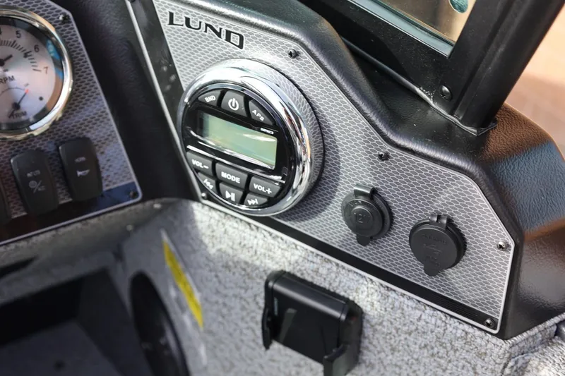 Slide: The Image of Control panel of 2026 Lund 1675 Adventure Sport boat with audio system and gauges. - 26