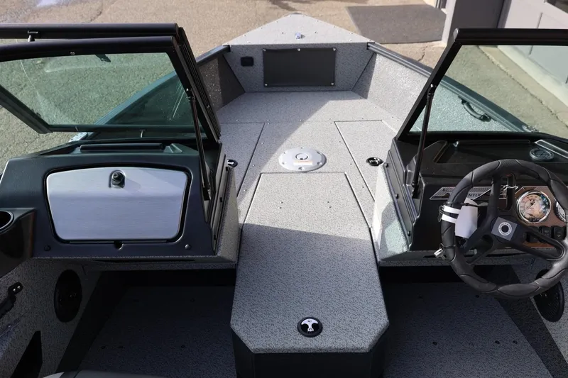 Slide: The Image of 2026 Lund 1675 Adventure Sport boat interior with steering wheel and dashboard. - 34