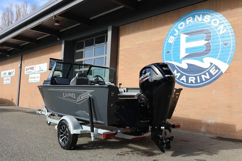 Slide: The Image of 2026 Lund 1675 Adventure Sport boat outside Bjornson Marine building. - 4