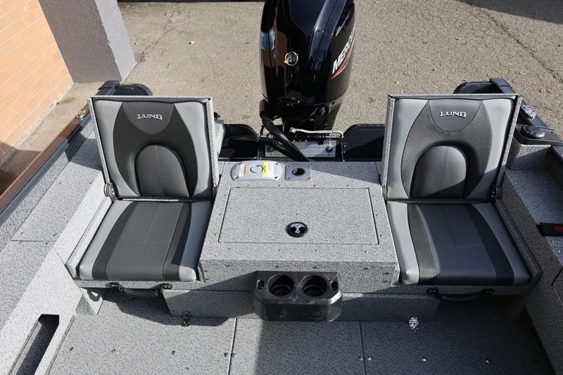 Slide: The Image of 2026 Lund 1675 Adventure Sport boat interior with dual seats and motor. - 40