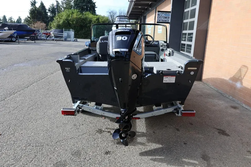 Slide: The Image of 2026 Lund 1675 Adventure Sport boat with Mercury engine on a trailer. - 5