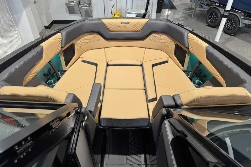 Slide: The Image of 2026 MasterCraft XStar 25 interior with luxurious tan and black seating. - 13