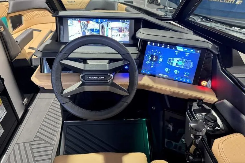 Slide: The Image of 2026 MasterCraft XStar 25 dashboard with advanced digital displays and modern steering wheel. - 30