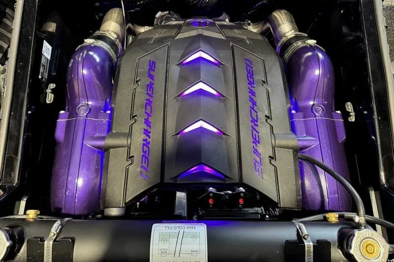Slide: The Image of 2026 MasterCraft XStar 25 supercharged engine with purple accents and sleek design. - 33