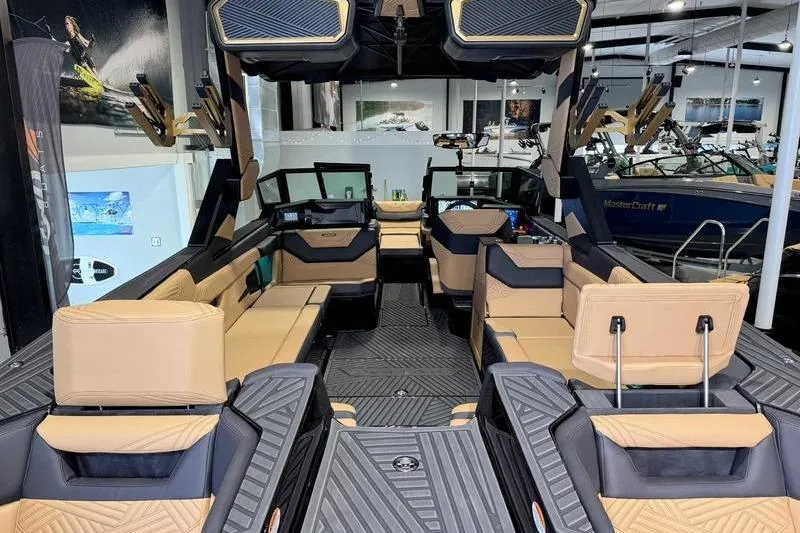 Slide: The Image of 2026 MasterCraft XStar 25 interior with luxurious seating and modern dashboard. - 8
