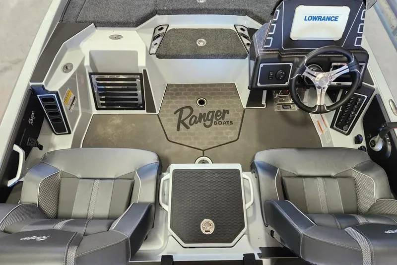 Slide: The Image of 2026 Ranger Z519R Cup-Equipped boat interior with steering wheel and seating. - 11