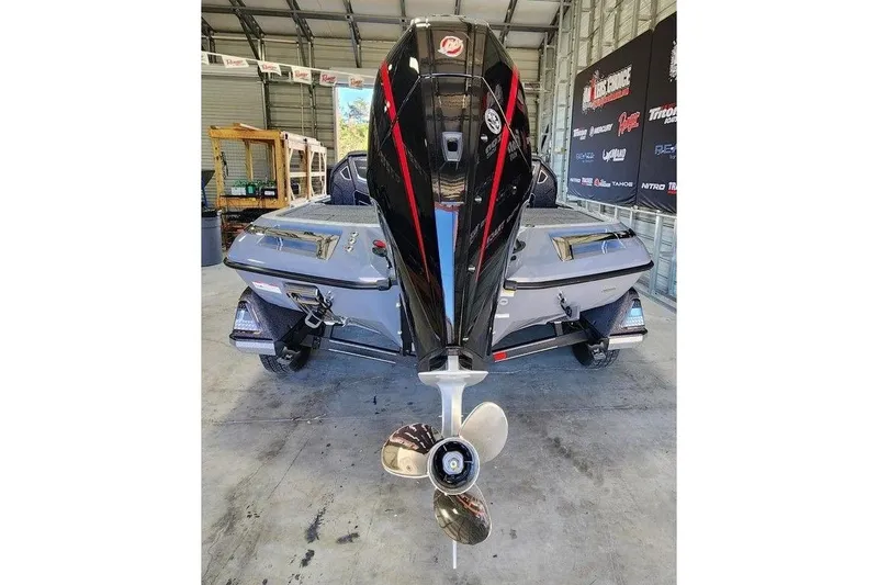 Slide: The Image of 2026 Ranger Z519R Cup-Equipped boat in a garage, showcasing its powerful engine. - 5