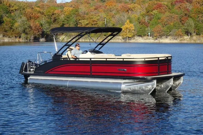 The Image of 2026 Harris Solstice 250 pontoon boat on a lake with autumn foliage background. - 0