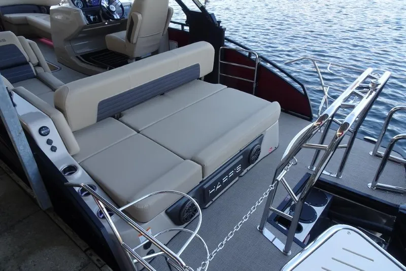 Slide: The Image of 2026 Harris Solstice 250 boat interior with luxurious seating and modern design on the water. - 11