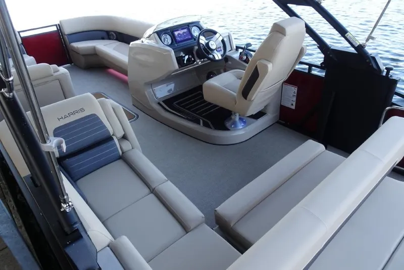 Slide: The Image of 2026 Harris Solstice 250 boat interior with luxurious seating and modern dashboard. - 12