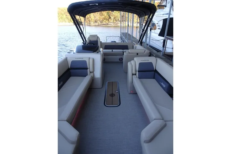 Slide: The Image of 2026 Harris Solstice 250 pontoon boat interior with spacious seating and canopy. - 23