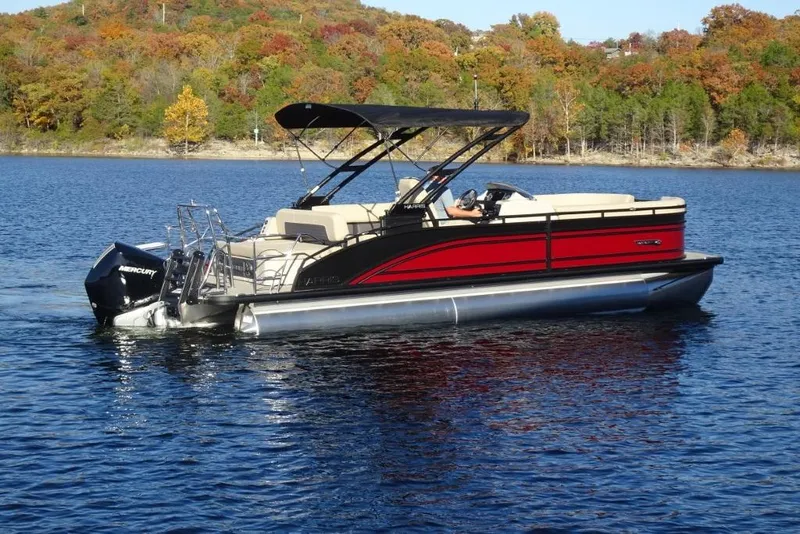 Slide: The Image of 2026 Harris Solstice 250 pontoon boat on a scenic lake with autumn foliage. - 3