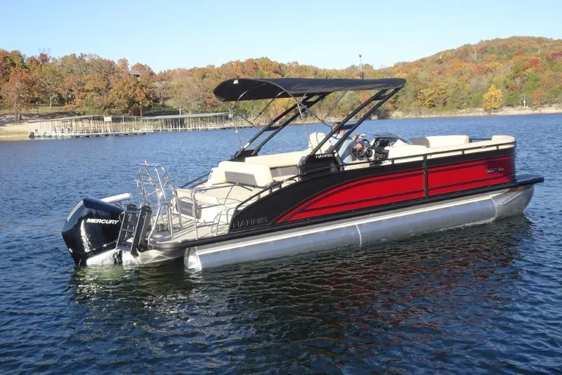 Slide: The Image of 2026 Harris Solstice 250 pontoon boat on a scenic lake with autumn foliage. - 4