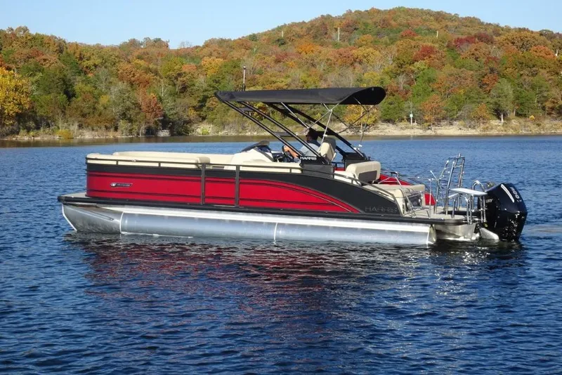 Slide: The Image of 2026 Harris Solstice 250 pontoon boat on a lake with autumn foliage background. - 6