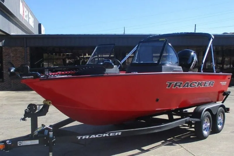 Slide: The Image of 2026 Tracker Pro Guide V-175 WT boat on trailer, vibrant red color, parked outdoors. - 3