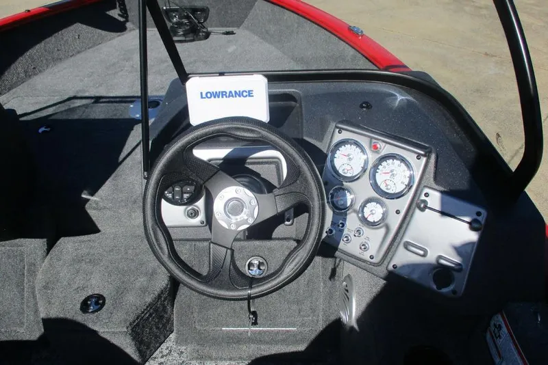 Slide: The Image of 2026 Tracker Pro Guide V-175 WT boat dashboard with steering wheel and gauges. - 5