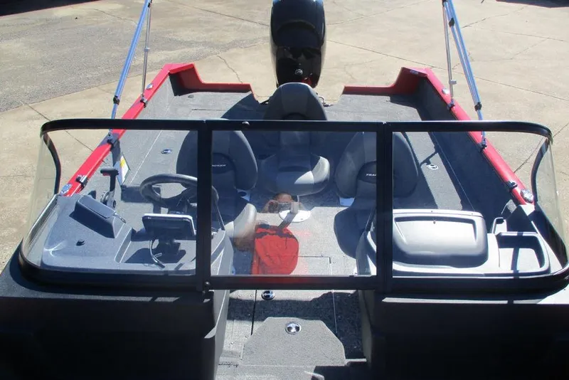 Slide: The Image of 2026 Tracker Pro Guide V-175 WT boat interior with seating and steering console. - 7