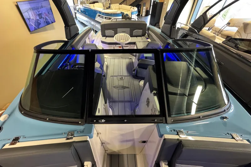 Slide: The Image of 2026 Chaparral 267 SSX boat interior with modern seating and sleek design. - 32