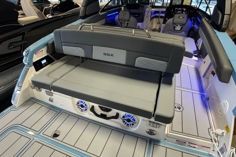 Slide: The Image of 2026 Chaparral 267 SSX boat interior with gray seating and modern dashboard. - 9