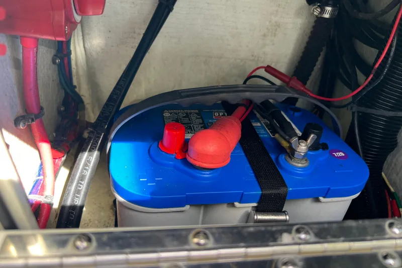 Slide: The Image of Battery compartment of 2017 Beavertail Skiffs Mosquito 18 with wiring connections. - 15