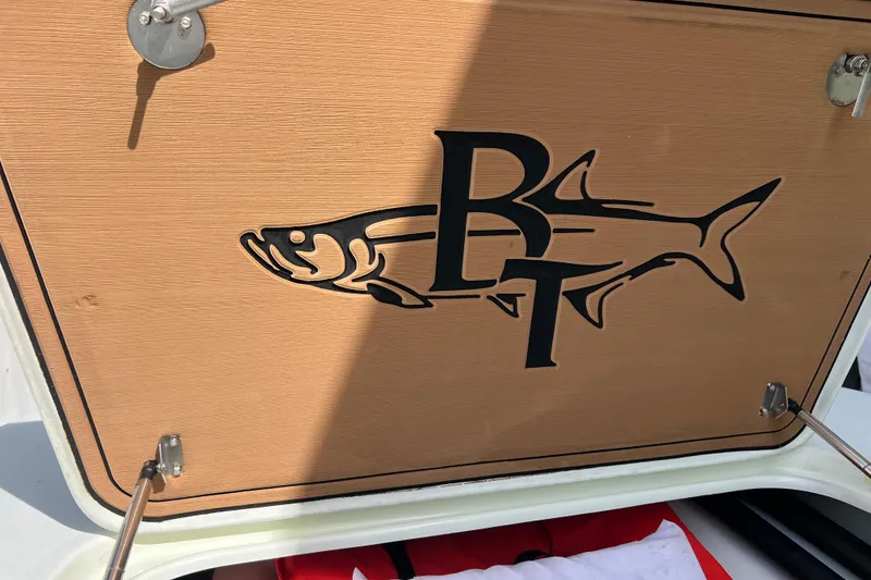 Slide: The Image of Beavertail Skiffs Mosquito 18 logo on a wooden hatch, 2017 model. - 20