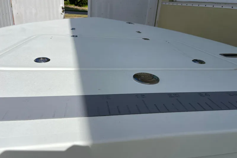 Slide: The Image of 2017 Beavertail Skiffs Mosquito 18 deck with measurement markings. - 22