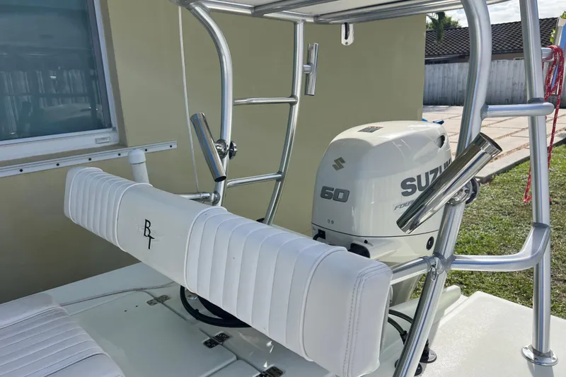 Slide: The Image of 2017 Beavertail Skiffs Mosquito 18 with Suzuki 60 outboard motor, white seating, and metal frame. - 28