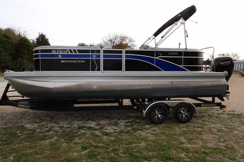 Slide: The Image of 2024 Bennington 22 SXS pontoon boat on trailer, side view. - 12