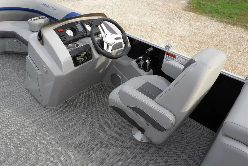 Slide: The Image of 2024 Bennington 22 SXS boat interior with steering console and seating. - 26