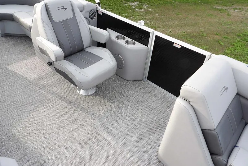 Slide: The Image of 2024 Bennington 22 SXS boat interior with gray seating and carpet flooring. - 27