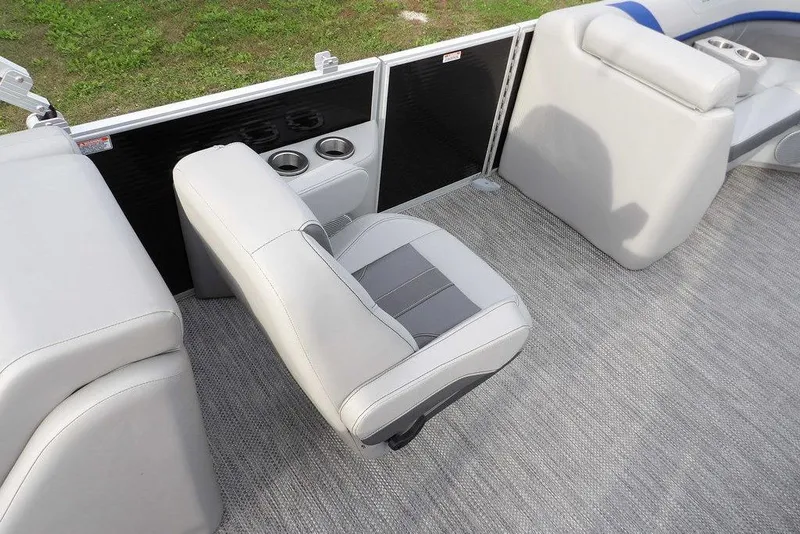 Slide: The Image of 2024 Bennington 22 SXS boat interior with gray seating and cup holders. - 28