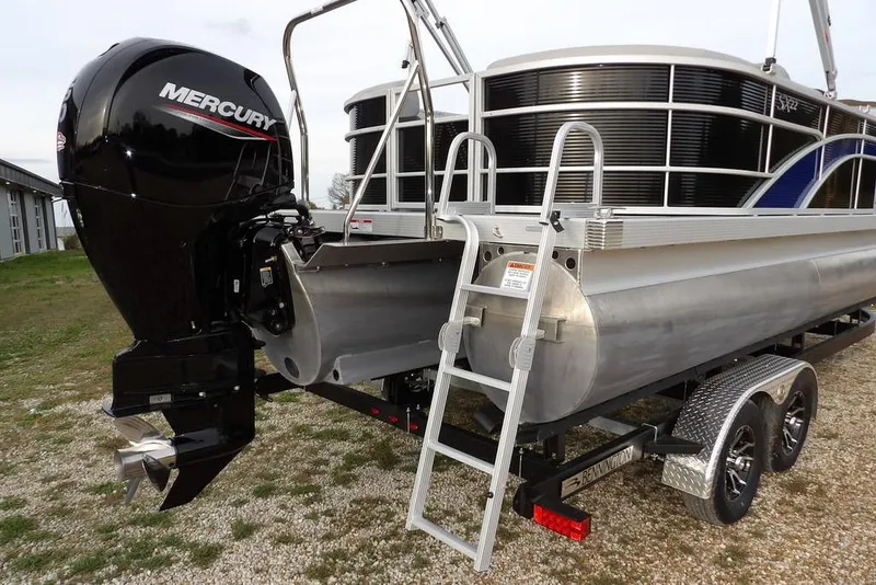 Slide: The Image of 2024 Bennington 22 SXS pontoon boat with Mercury outboard motor and trailer. - 3
