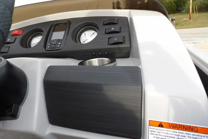 Slide: The Image of Dashboard of 2024 Bennington 22 SXS boat with gauges and warning label. - 30