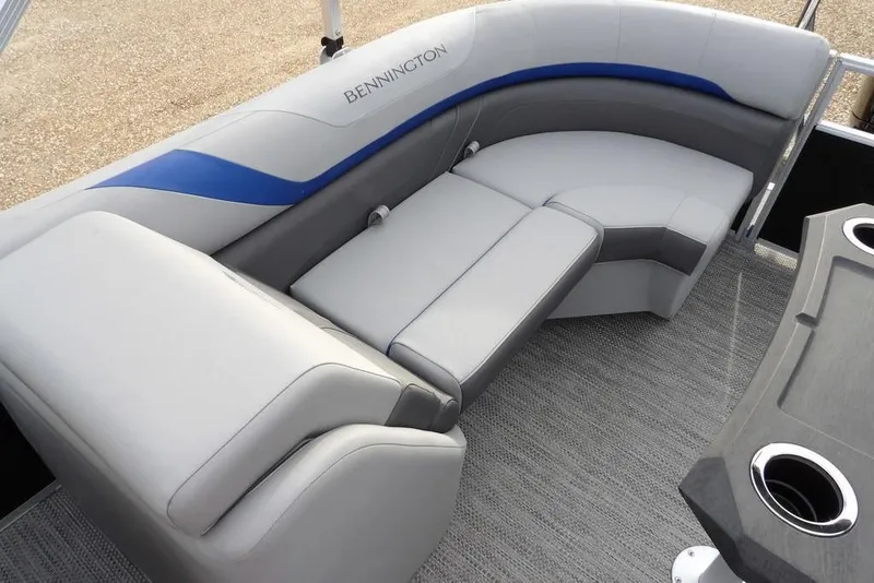 Slide: The Image of 2024 Bennington 22 SXS boat interior with gray and blue seating. - 35