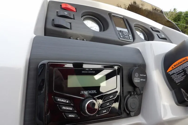 Slide: The Image of 2024 Bennington 22 SXS dashboard with media center and control panel. - 36