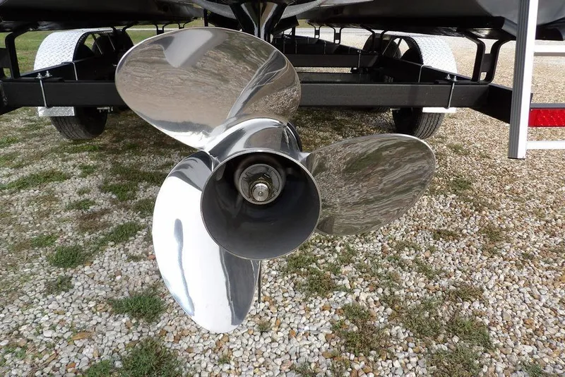Slide: The Image of 2024 Bennington 22 SXS boat propeller on gravel surface. - 40