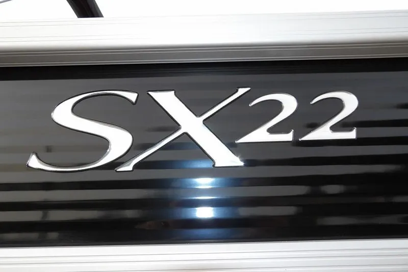 Slide: The Image of 2024 Bennington 22 SXS logo on sleek black background. - 6