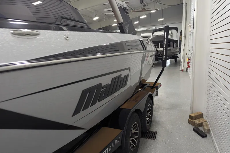 Slide: The Image of 2022 Malibu Wakesetter 22 LSV boat in showroom, side view. - 12