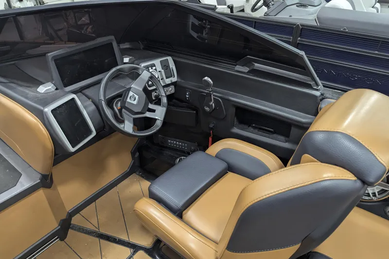 Slide: The Image of 2022 Malibu Wakesetter 22 LSV interior with modern dashboard and leather seating. - 13