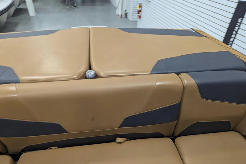 Slide: The Image of 2022 Malibu Wakesetter 22 LSV interior seating, tan and gray upholstery. - 20