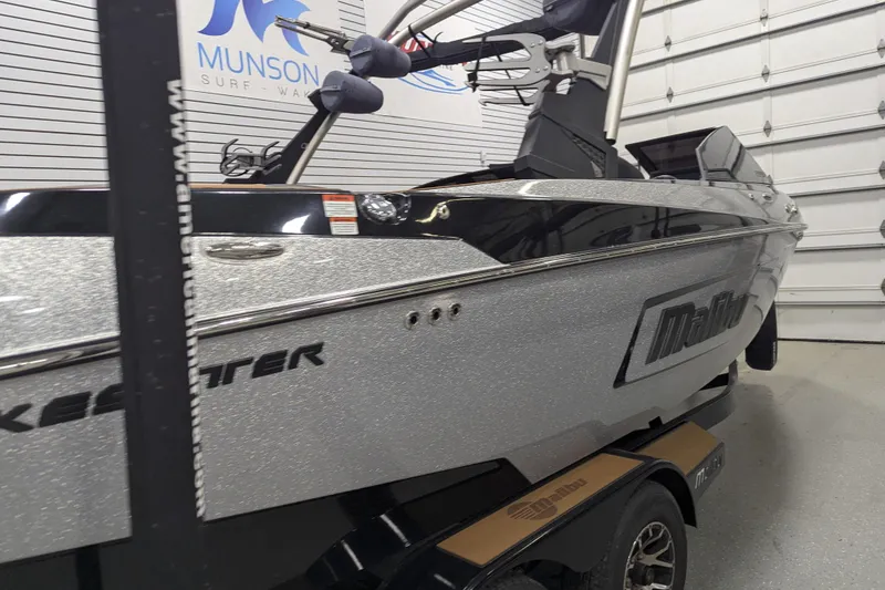 Slide: The Image of 2022 Malibu Wakesetter 22 LSV boat in showroom, silver finish, side view. - 3