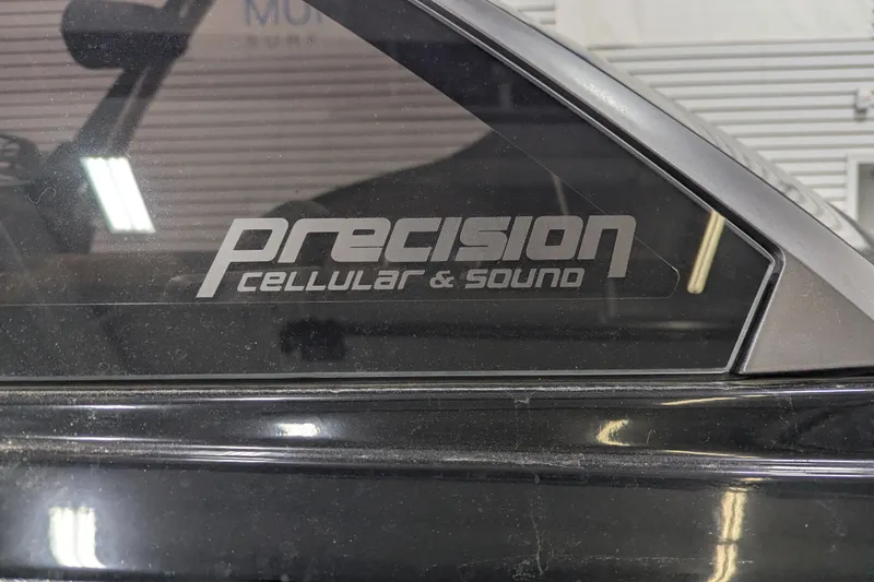 Slide: The Image of Precision Cellular & Sound logo on vehicle window, Malibu Wakesetter 22 LSV 2022 model. - 6