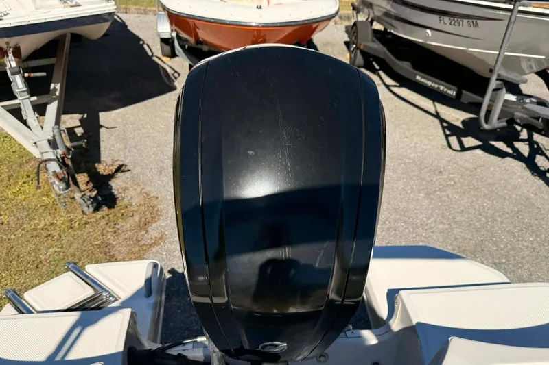 Slide: The Image of 2021 Bayliner Element E16 outboard motor, parked among other boats. - 11