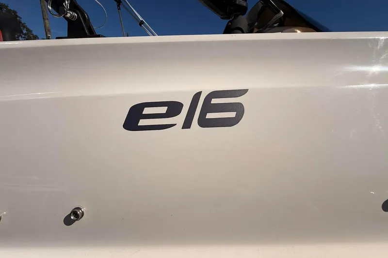 Slide: The Image of 2021 Bayliner Element E16 boat logo on white surface, close-up view. - 2