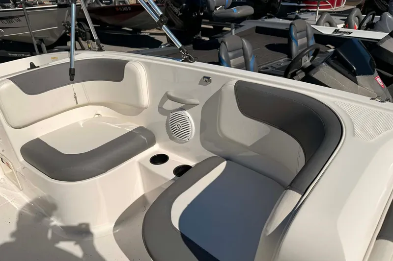 Slide: The Image of 2021 Bayliner Element E16 boat interior with gray and white seating. - 7