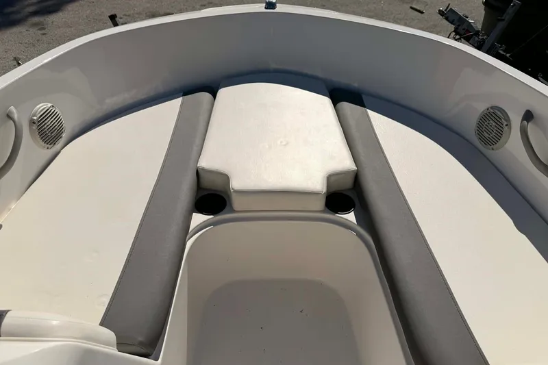 Slide: The Image of 2021 Bayliner Element E16 boat interior with cushioned seating and speakers. - 8