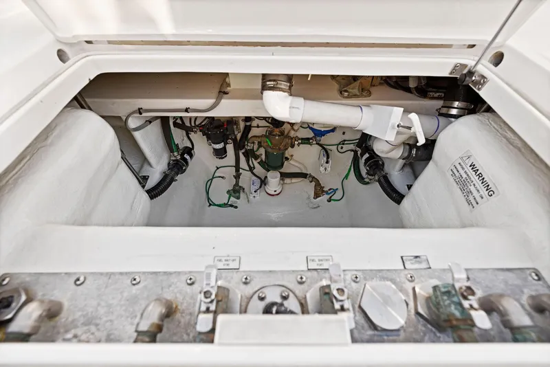 Slide: The Image of Engine compartment of a 2012 Cabo 44 Hardtop Express boat. - 20