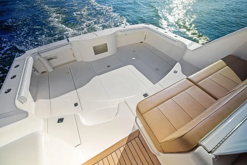 Slide: The Image of 2012 Cabo 44 Hardtop Express boat deck with seating and ocean view. - 27