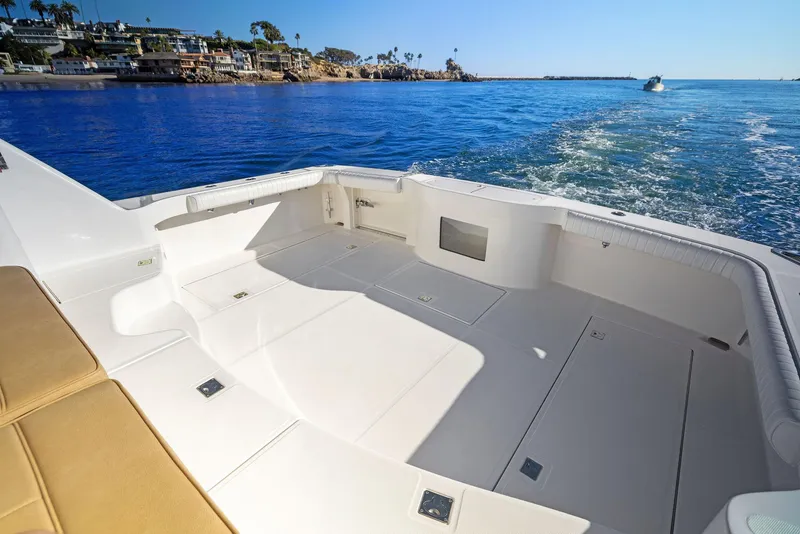 Slide: The Image of 2012 Cabo 44 Hardtop Express boat deck with ocean view. - 31
