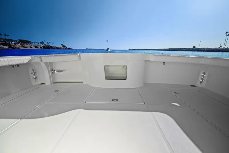 Slide: The Image of 2012 Cabo 44 Hardtop Express boat deck with ocean view. - 32